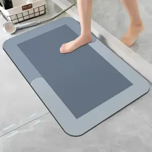 Blaue Badematte mit hellem Rand und abgerundeten Ecken – Blau